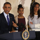 President Barack Obama speaks as his daughters, Sasha and Malia, look on before the president pardons turkeys Cheese and Mac, both 20 weeks old and 48 pounds, at the White House on Nov. 26, 2014, in Washington, D.C.
Mark Wilson/Getty Images